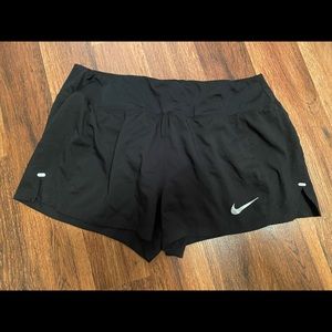 Black Nike running shorts